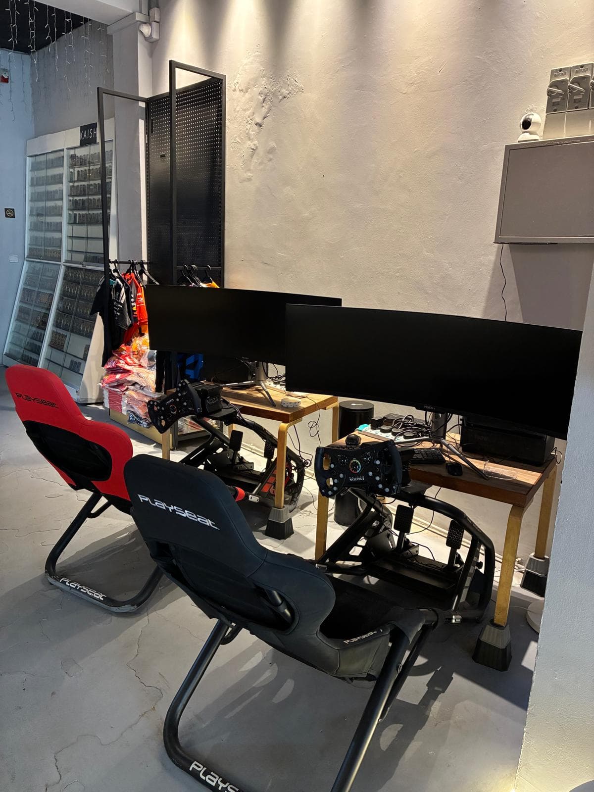 Racing seats, steering wheels, and simulator screens at KAISH